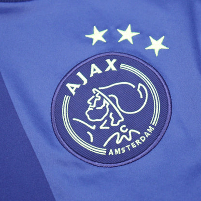 Close-up of Ajax club crest with three stars above it
