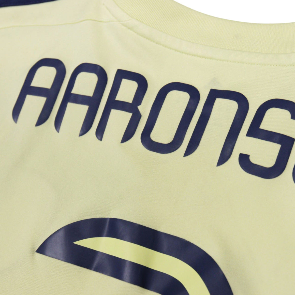 Close-up of Aaronson nameset on back of shirt showing fabric detail
