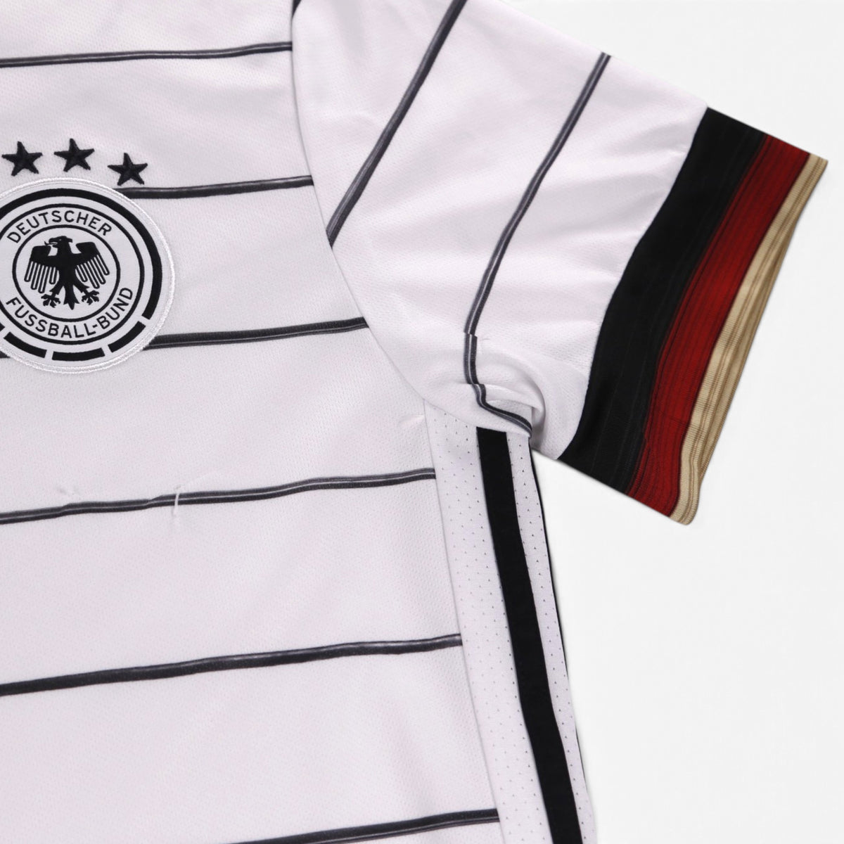 Close-up of the DFB crest, four stars and sleeve cuff stripes