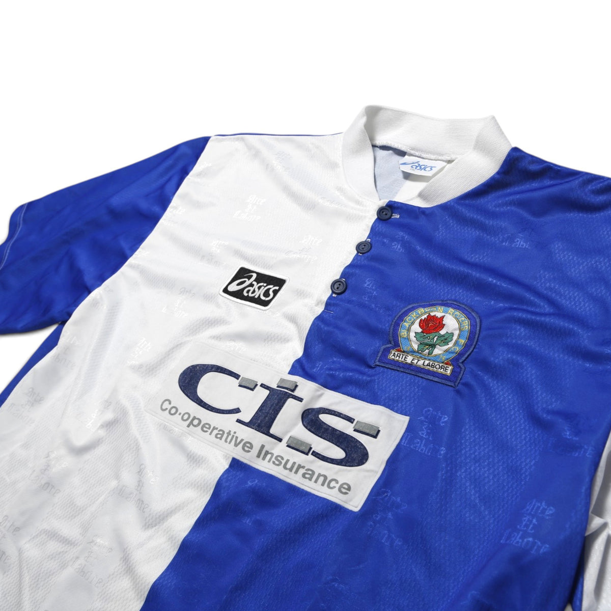 Close-up of Blackburn Rovers crest, Asics logo and CIS sponsor on shirt front