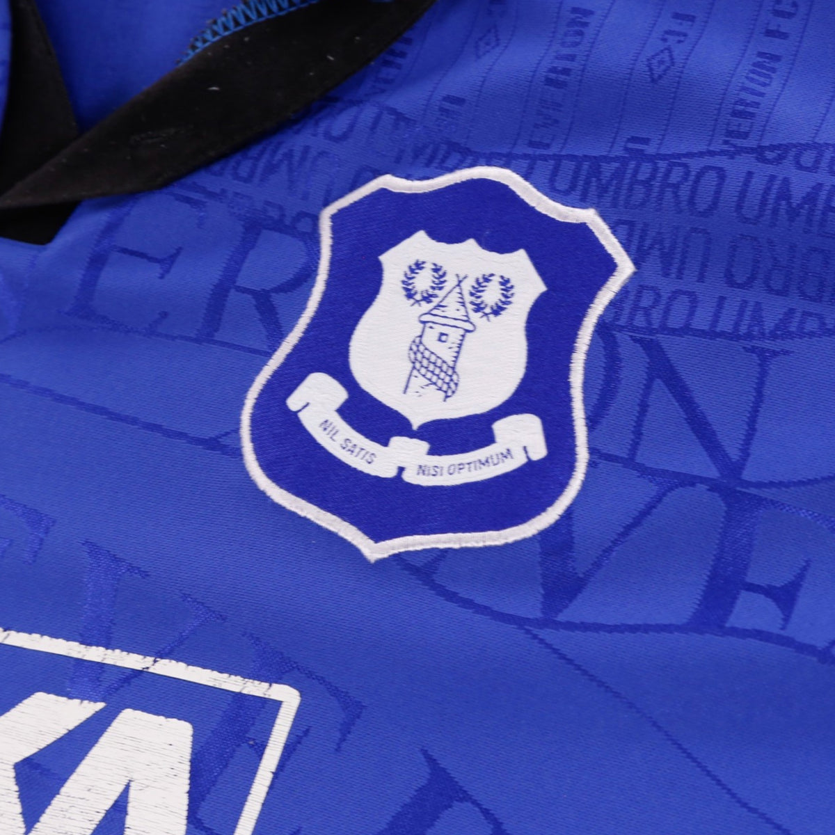 Close-up of Everton crest and collar detail on shirt