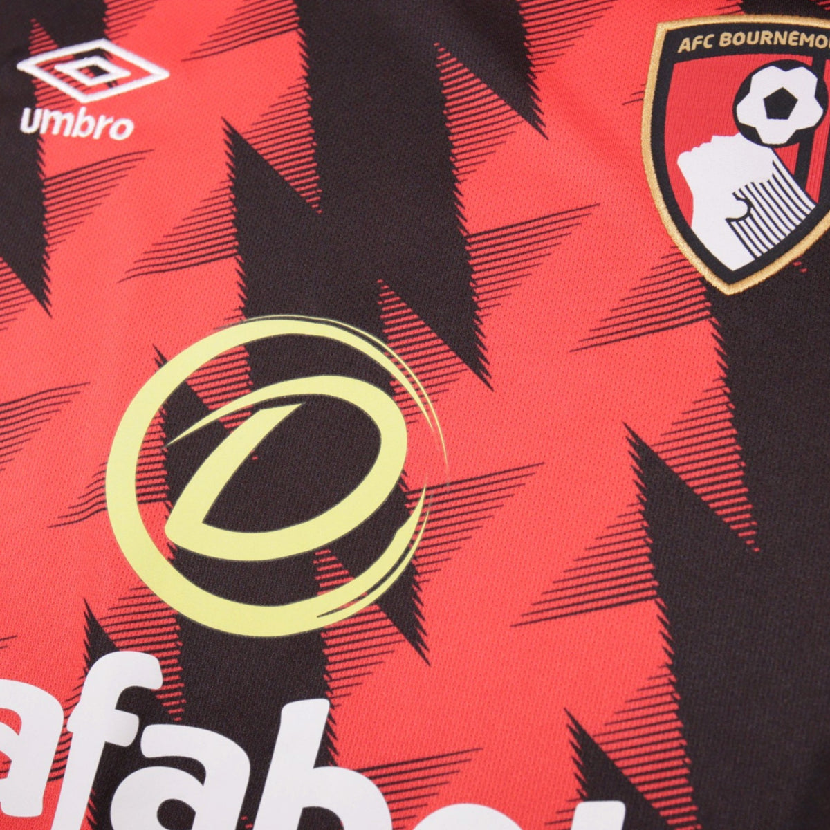 Close-up of Umbro logo and AFC Bournemouth crest on chest
