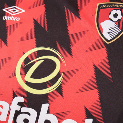 Close-up of Umbro logo and AFC Bournemouth crest on chest