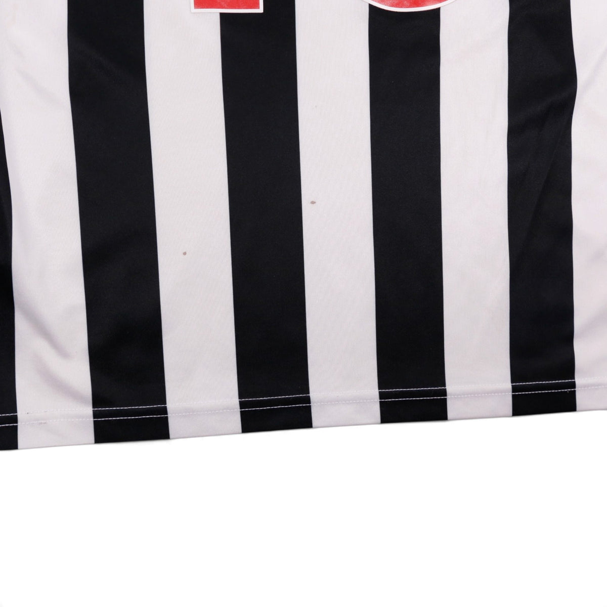 Close-up of the front hem showing small marks on the fabric