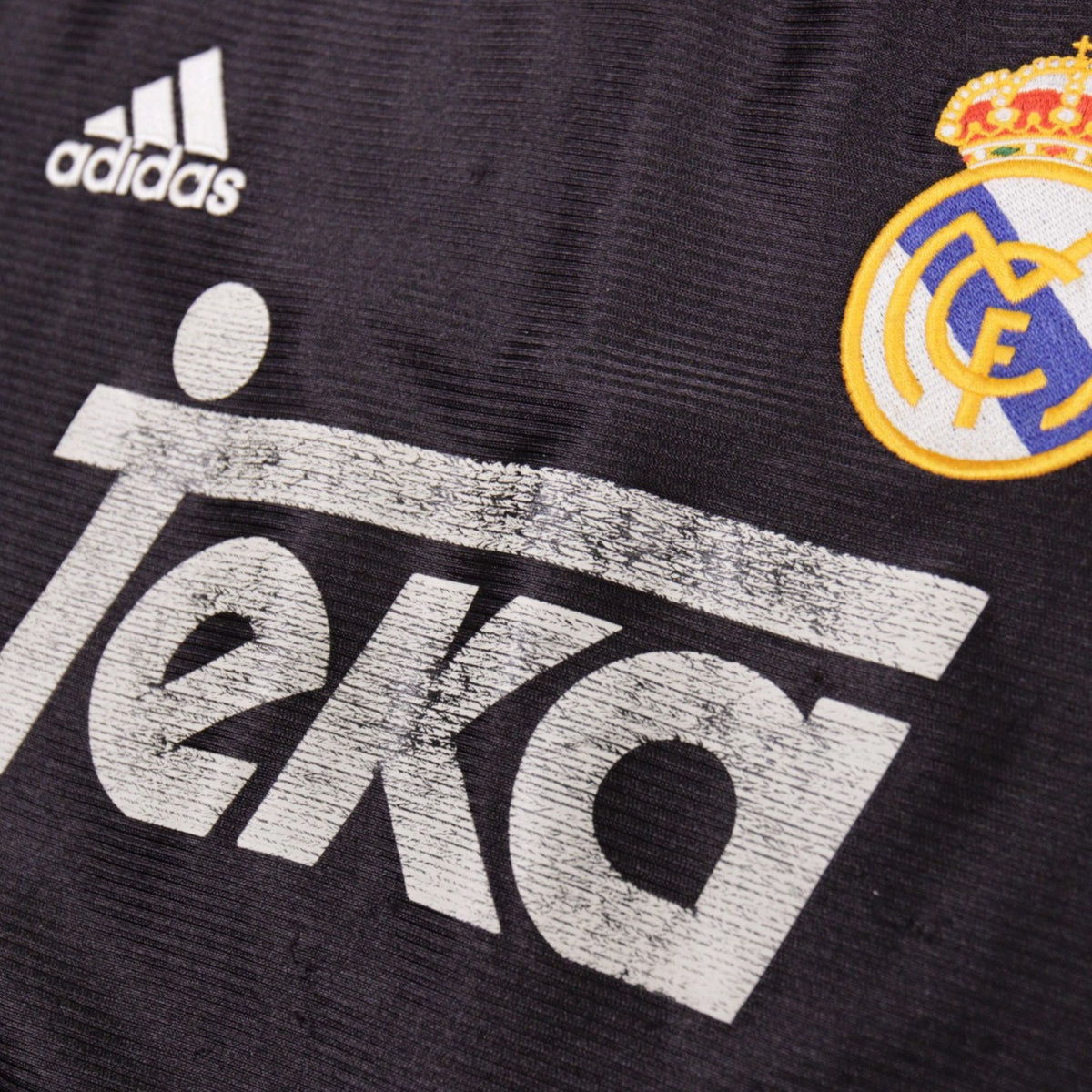 Close-up of Teka sponsor print and Real Madrid crest on 1999/00 away shirt