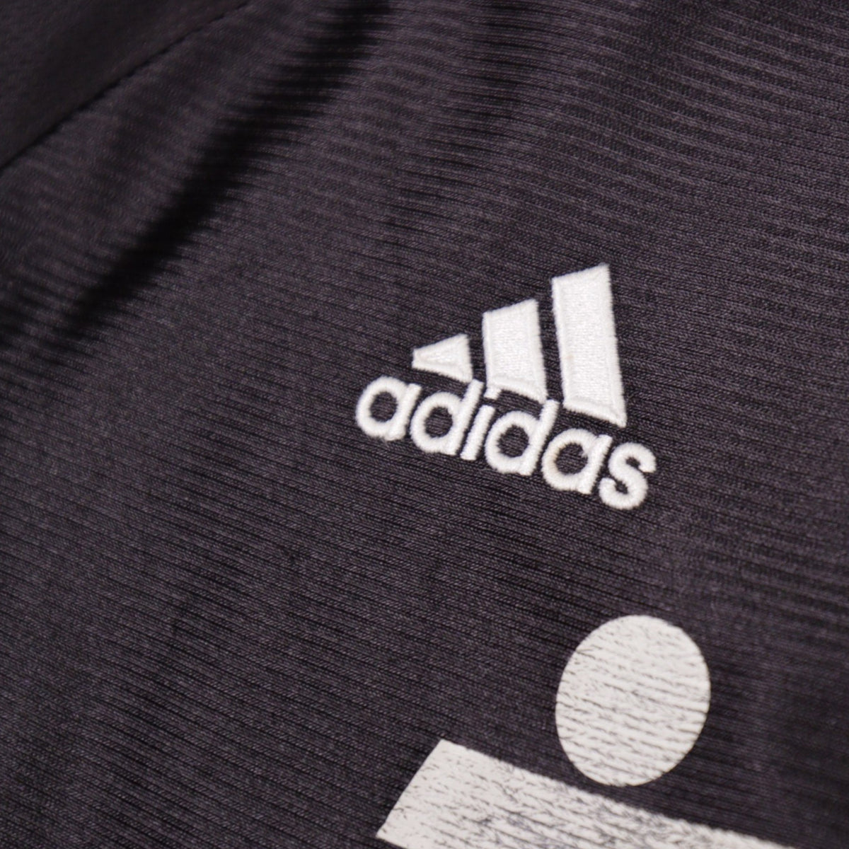 Close-up of adidas logo on 1999/00 Real Madrid away shirt