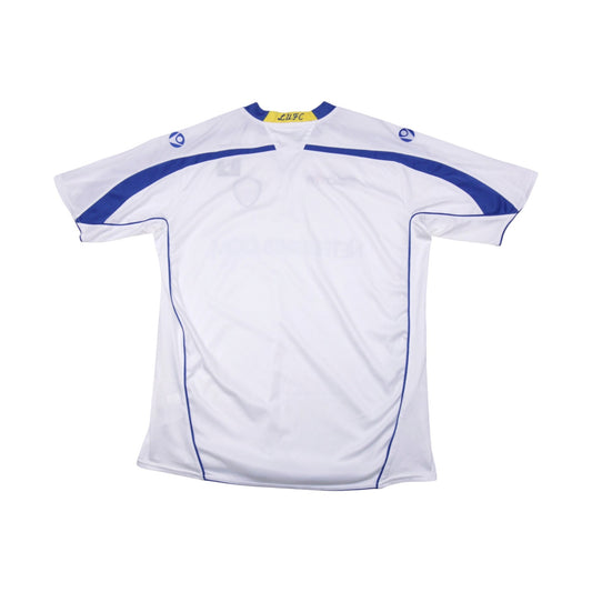 Back view of Leeds United home shirt showing plain white body and blue shoulder panelling
