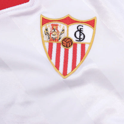 Close-up of embroidered Sevilla crest on the shirt