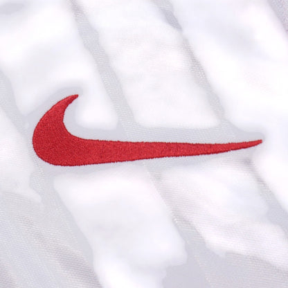 Close-up of the Nike swoosh logo on the shirt