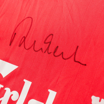 Close-up of the handwritten signature on the shirt chest
