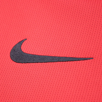 Close-up of the Nike swoosh logo on the shirt sleeve