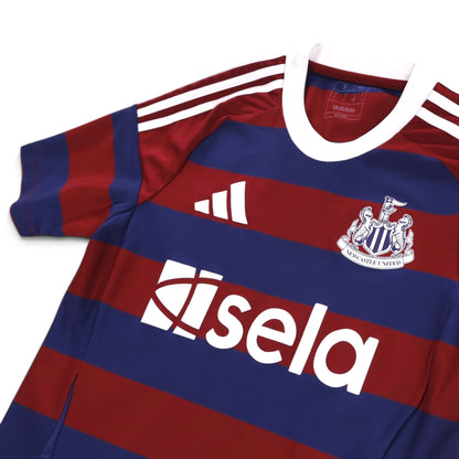 Close-up of adidas and Newcastle United crest on the 2024/25 away shirt with neck label