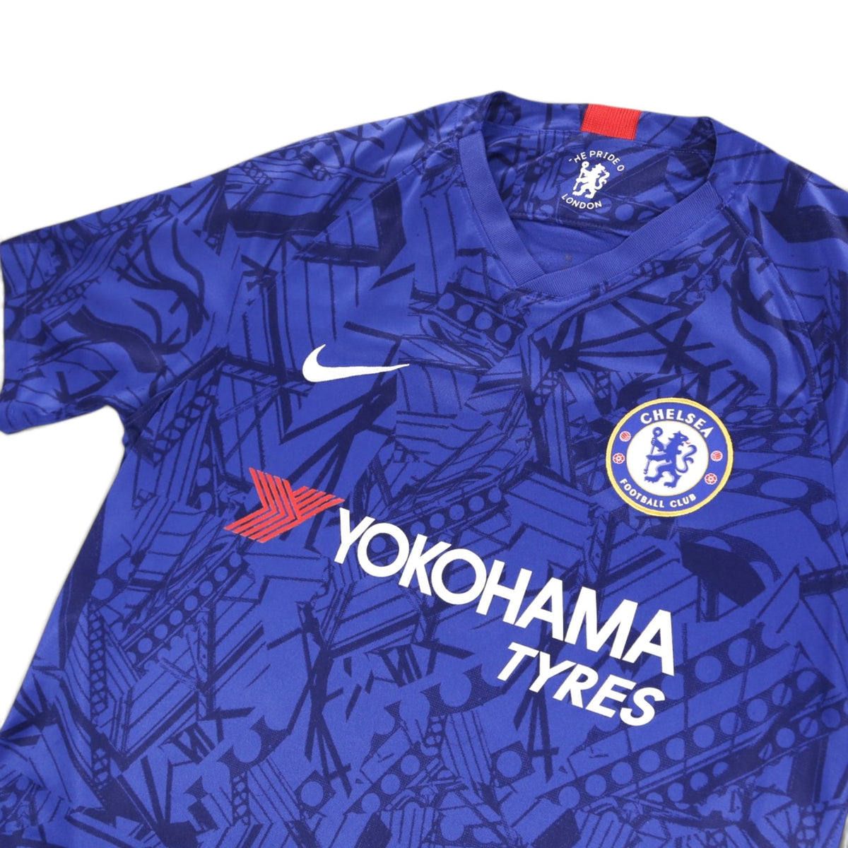 Close-up of the V-neck collar and neck label on the Chelsea home shirt
