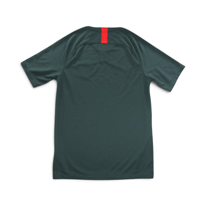Close-up of AS Monaco away shirt collar, crest, and Nike swoosh detail