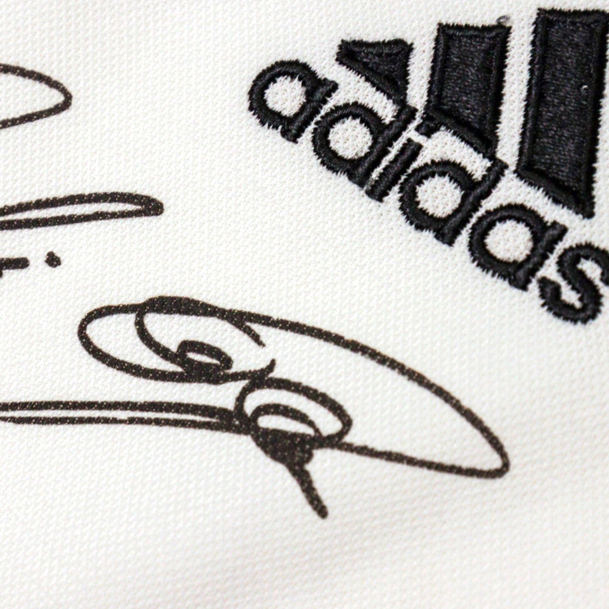 adidas logo and three-stripe trim on the Germany shirt