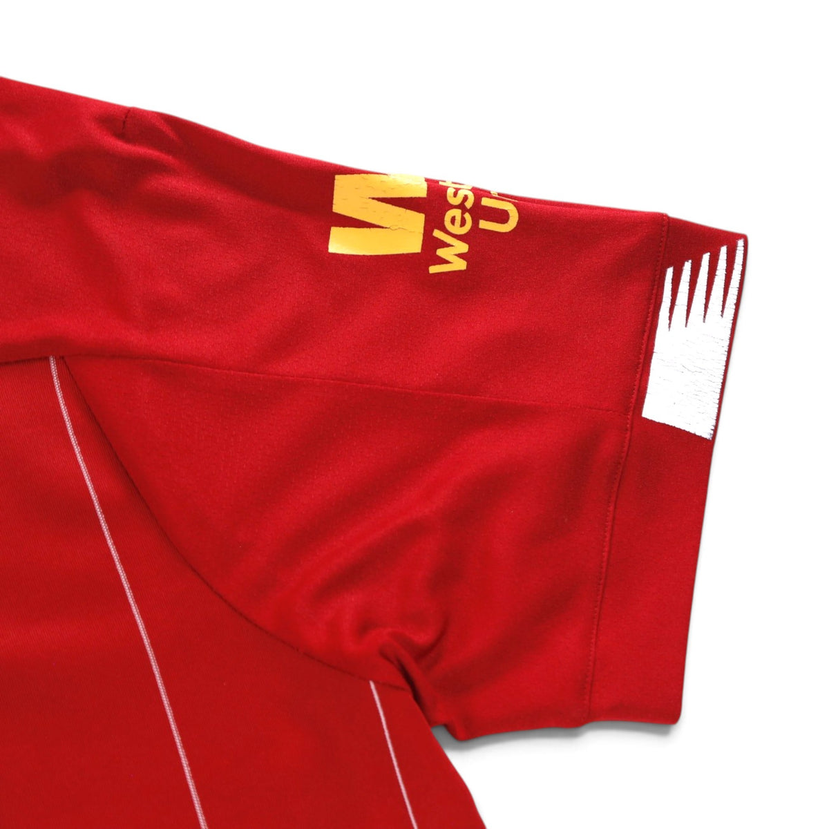 Close-up of the sleeve cuff showing the white chevron detail and cracking