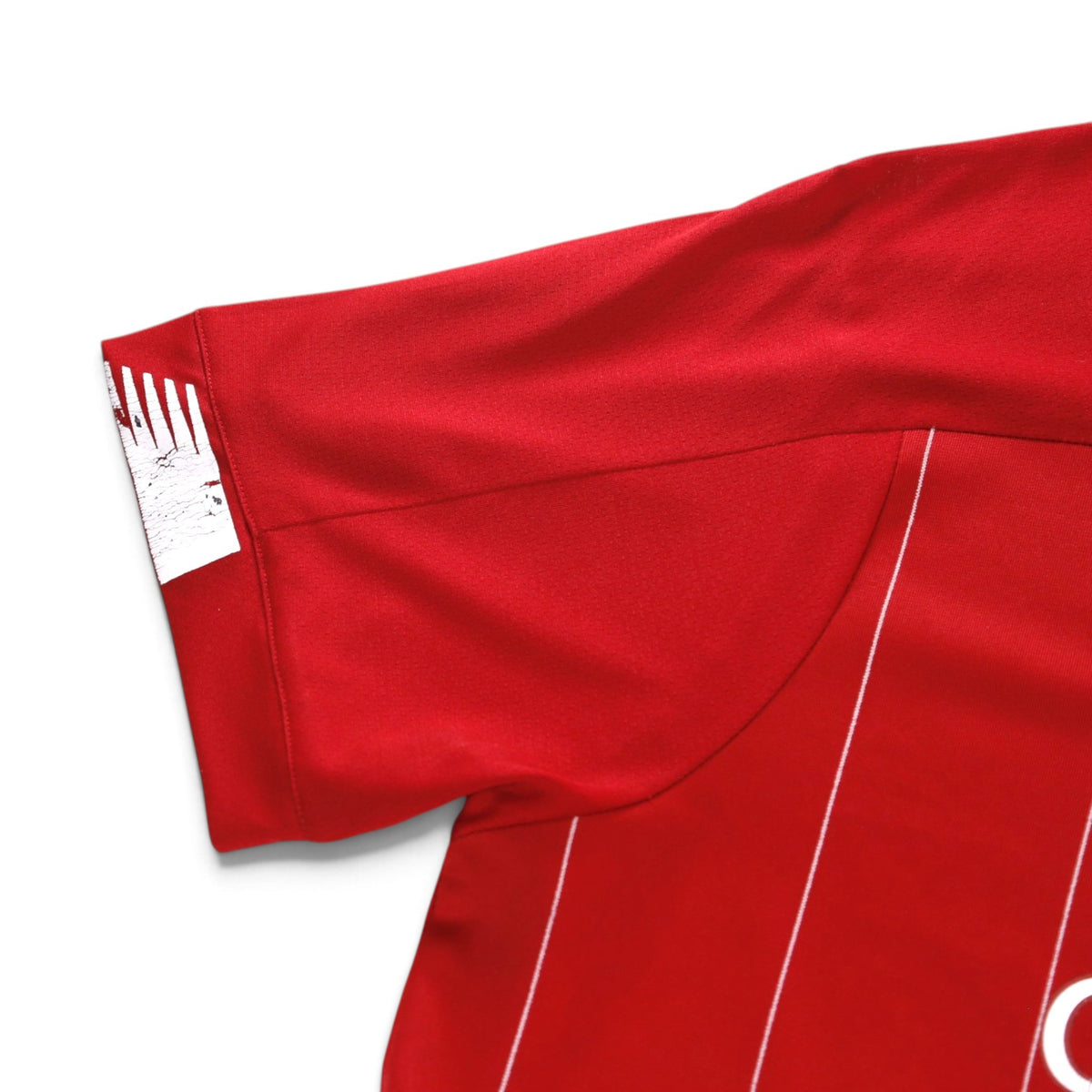 Close-up of the sleeve cuff and shoulder seam from the back