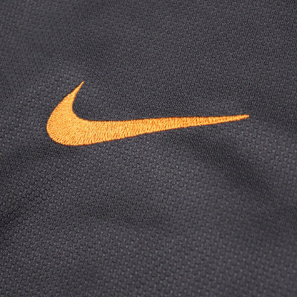 Close-up of the embroidered Nike swoosh on the chest