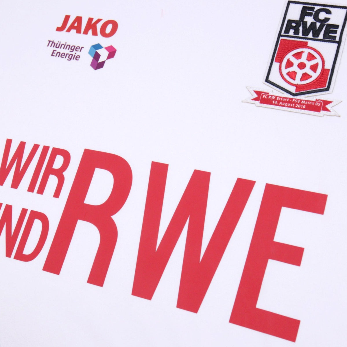 Close-up of the JAKO logo, Thüringer Energie sponsor and FC RWE crest with match patch