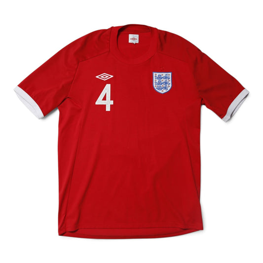 Front of 2010/12 England away shirt with number 4 and Three Lions crest