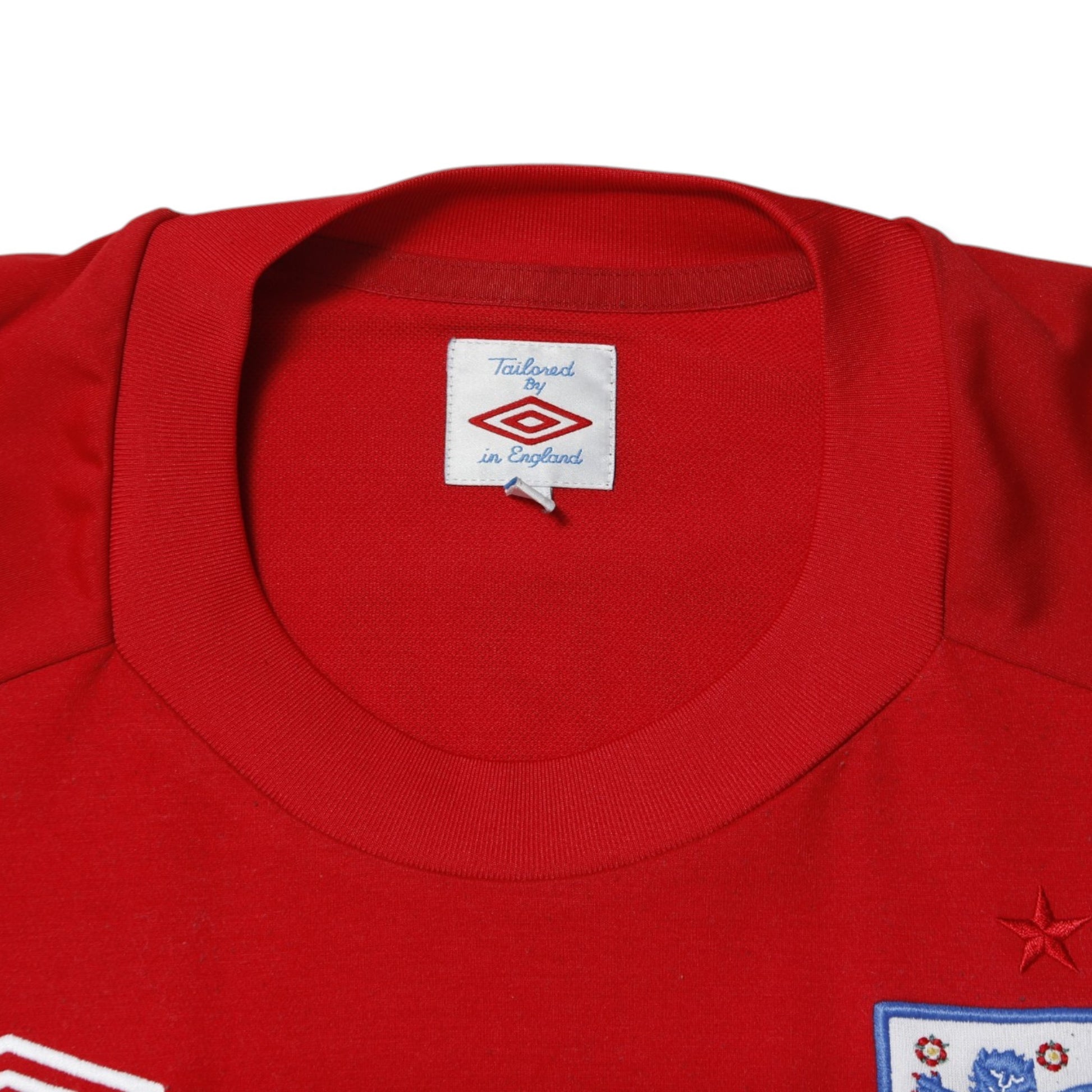 Umbro neck label on 2010/12 England away shirt showing 'Tailored By Umbro in England'
