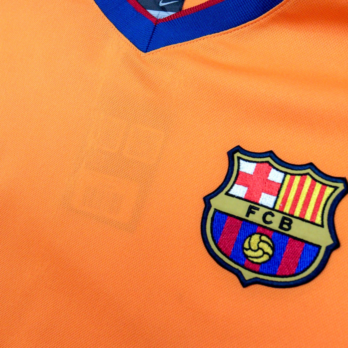 Close-up of the collar and crest detail on the chest