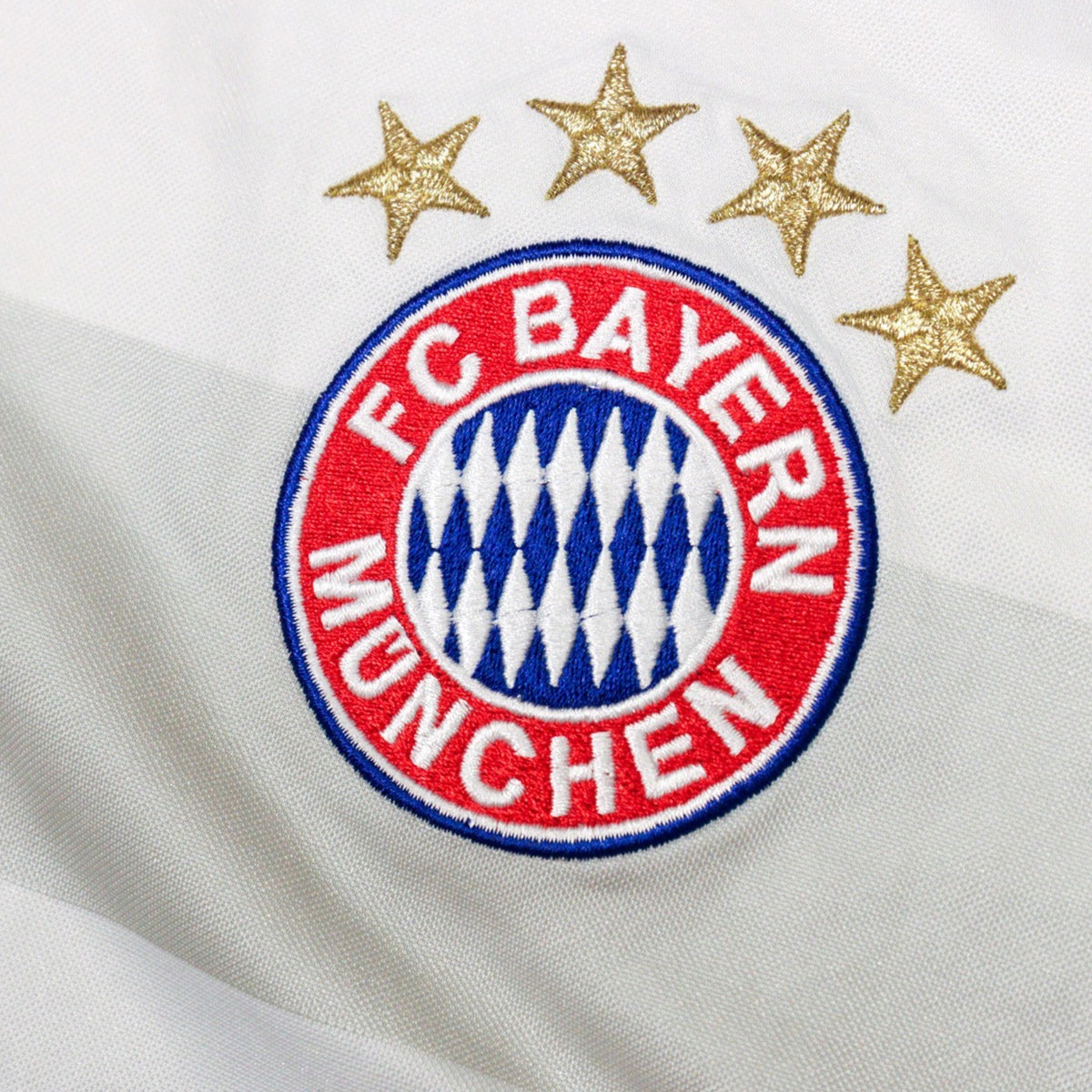 Close-up of FC Bayern München crest with four gold stars