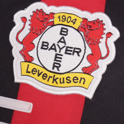 Close-up of the Bayer Leverkusen crest showing fabric detail