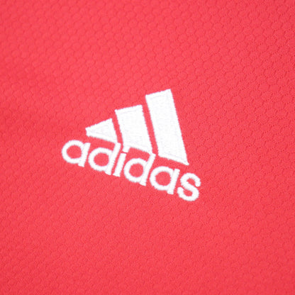 Close-up of adidas logo on shirt fabric