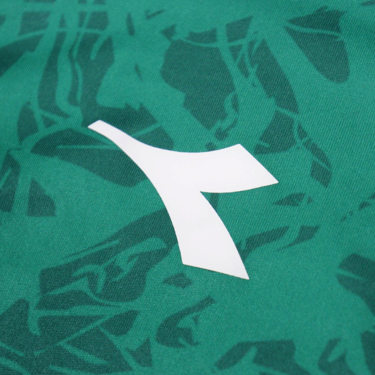 Close-up of the Diadora logo on the sleeve fabric