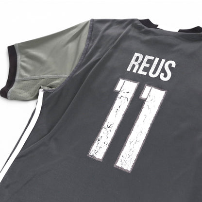 Close-up of cracked REUS 11 print and sleeve seam on Germany away shirt