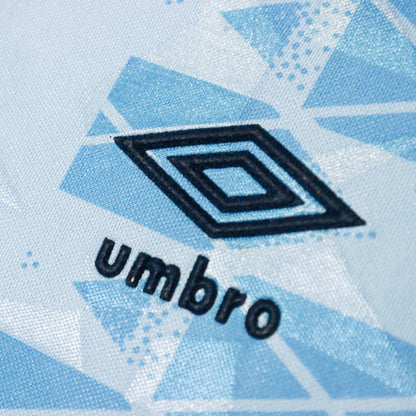 Close-up of the Umbro logo on the chest of the shirt