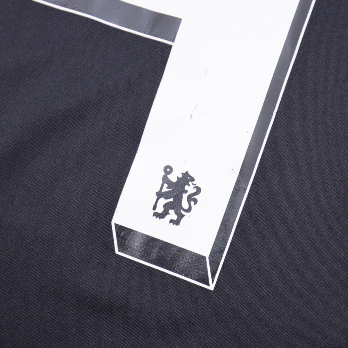 Close-up of number 4 and Chelsea crest print on sleeve