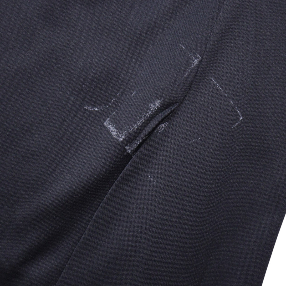 Close-up of fabric showing scuff marks on the shirt body
