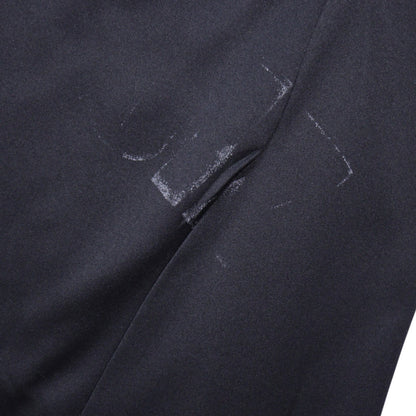 Close-up of fabric showing scuff marks on the shirt body