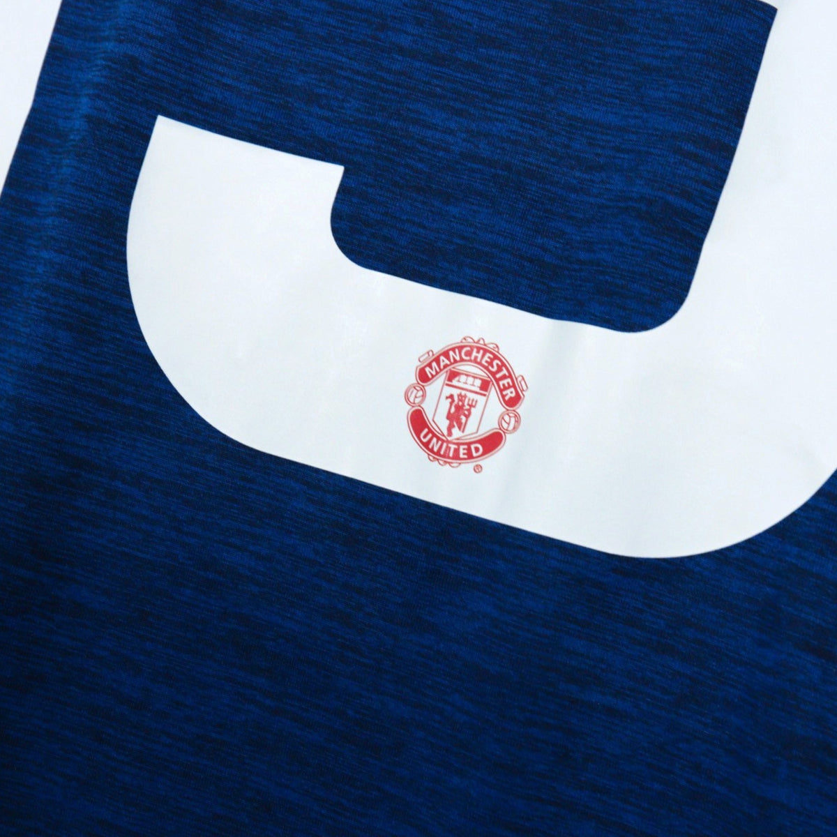 Close-up of number 19 and Manchester United crest beneath it