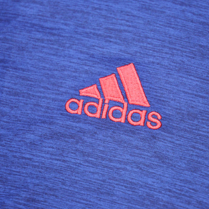 Close-up of adidas logo on shirt fabric
