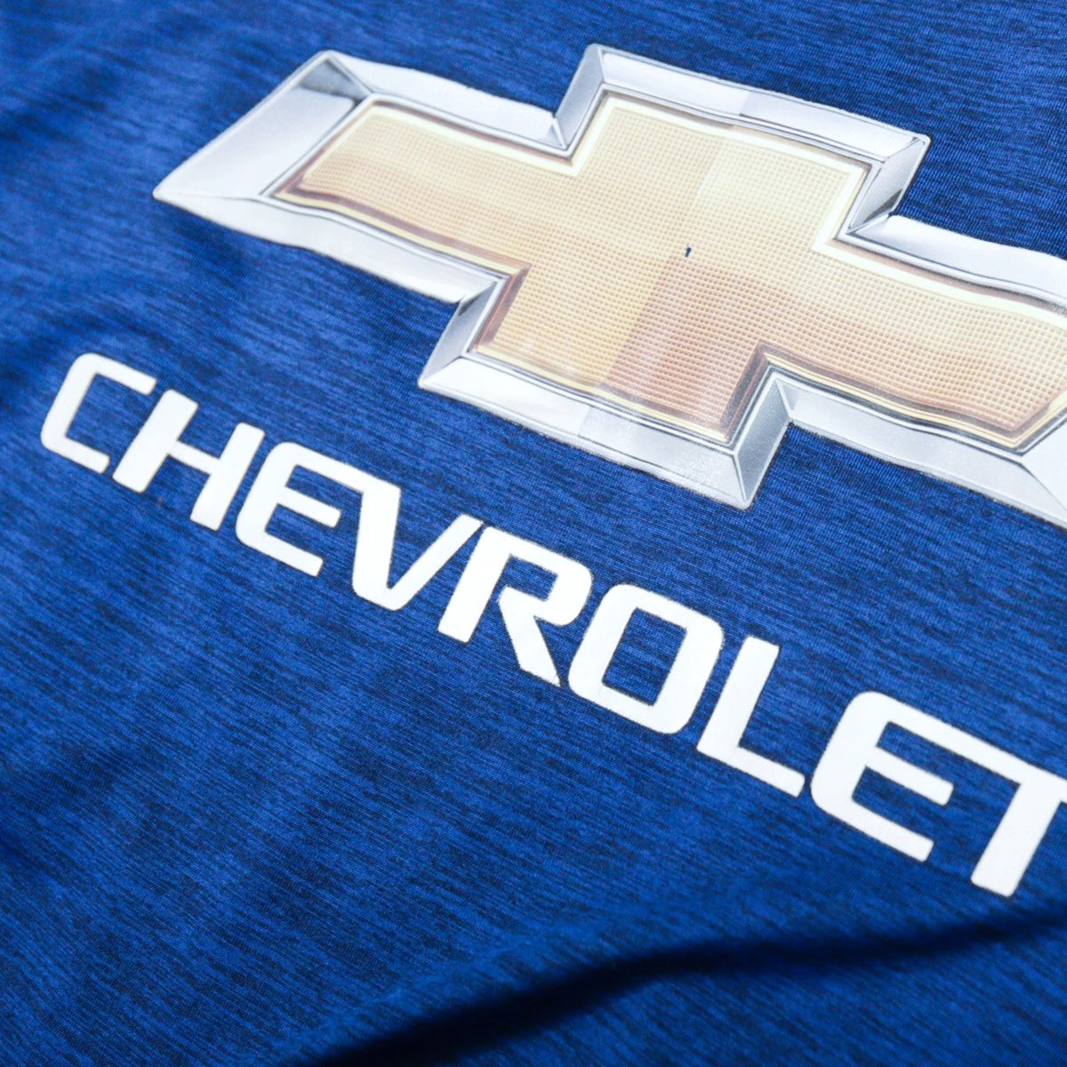 Close-up of Chevrolet sponsor print on the chest