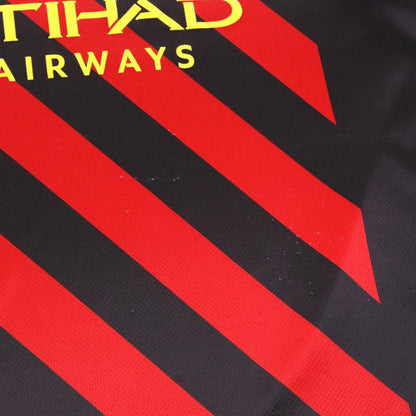 Close-up of the front fabric showing diagonal red stripes and small marks