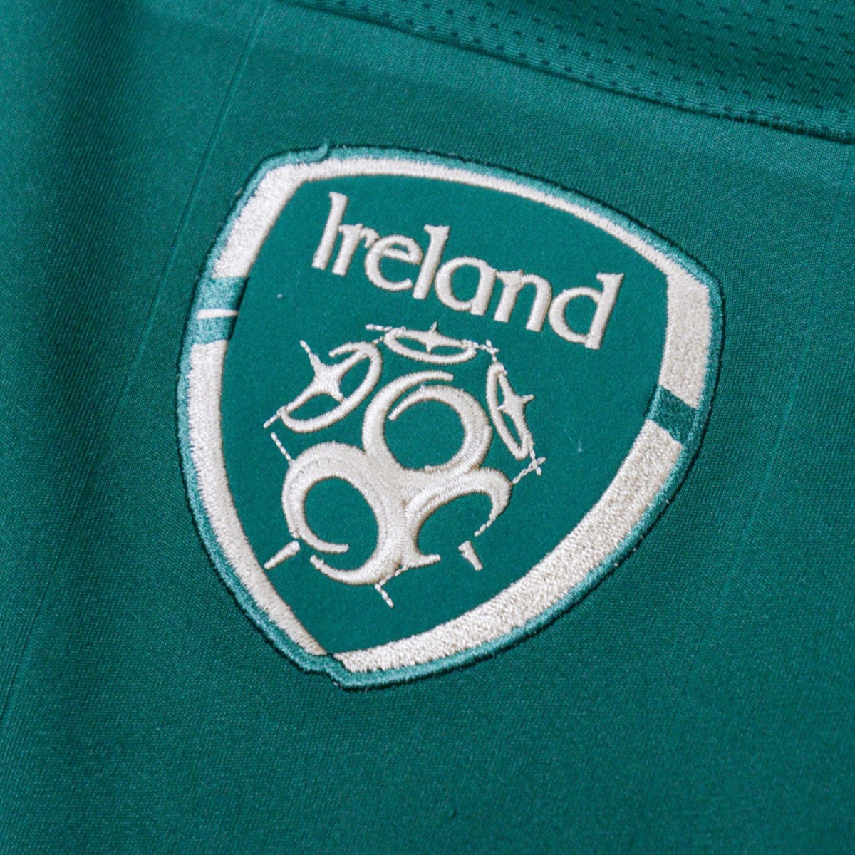Close-up of the embroidered Ireland crest on the chest of the home shirt