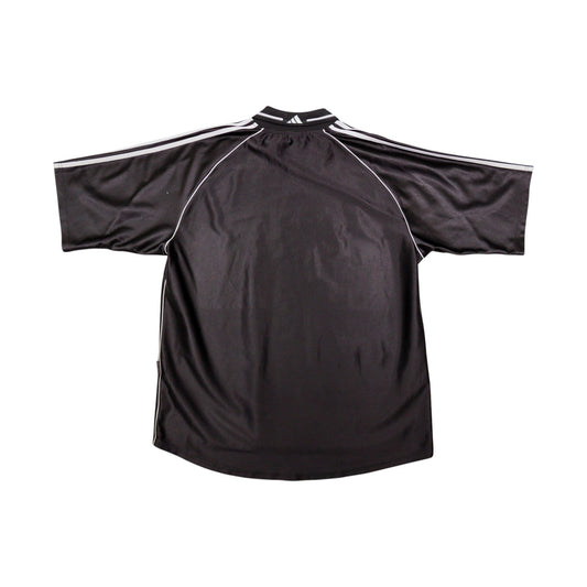 Back of black Preußen Münster away shirt showing plain body and white sleeve stripes