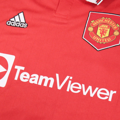 Close-up of adidas logo, Manchester United crest and TeamViewer sponsor on shirt front