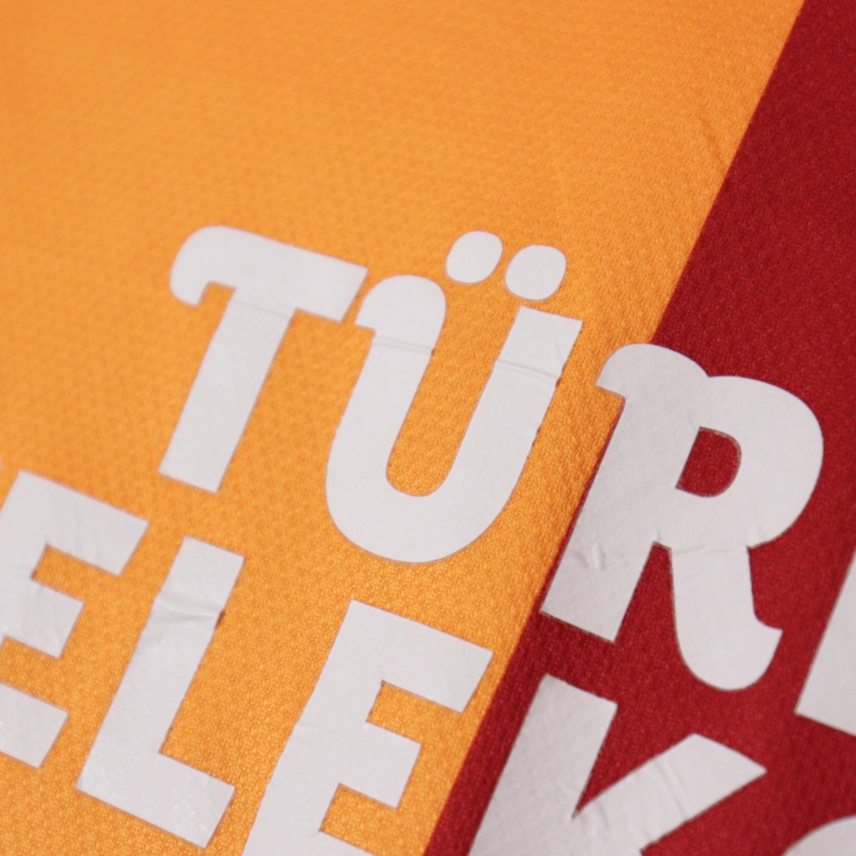 Close-up of the Türk Telekom sponsor print lettering