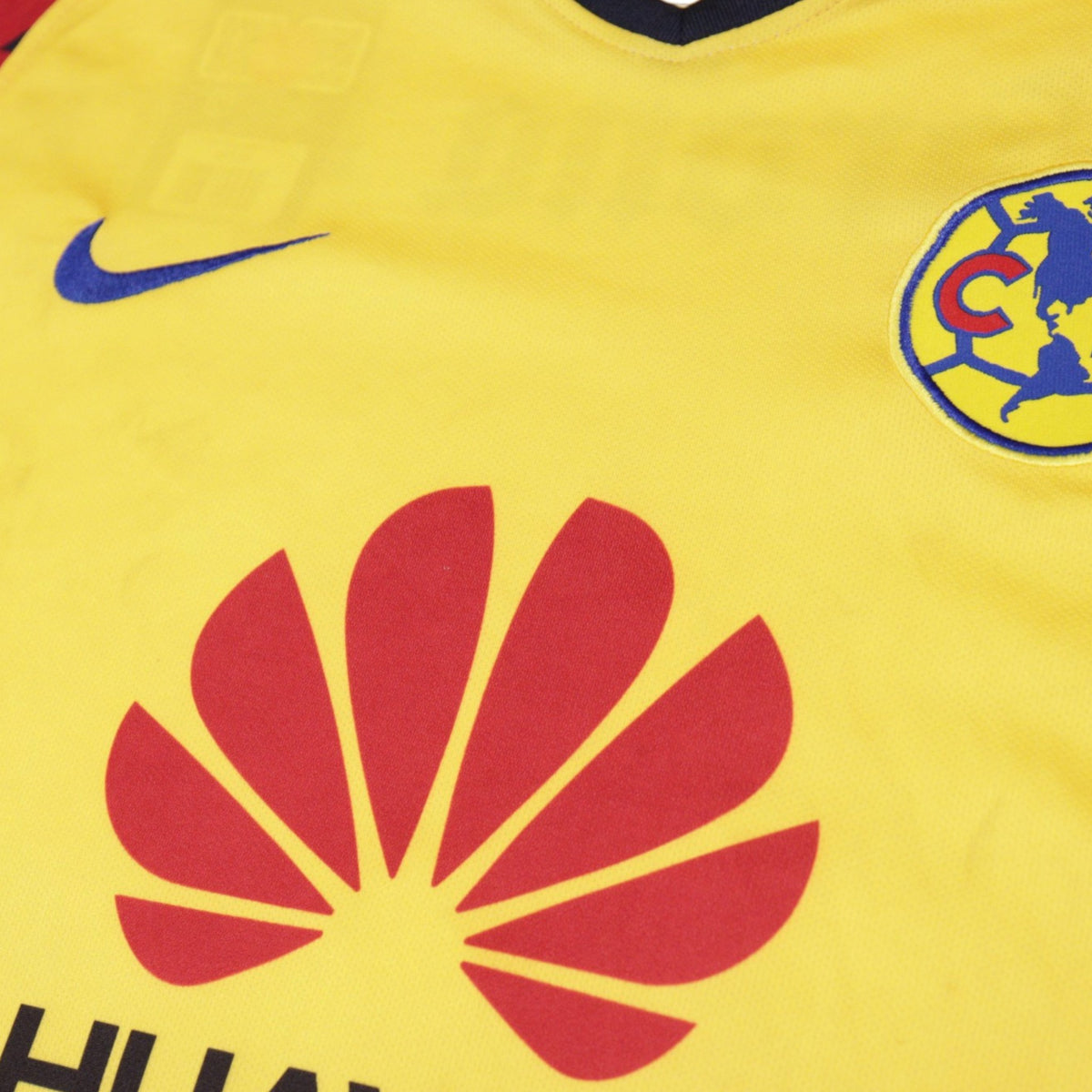 Close-up of Nike logo, América crest and Huawei sponsor on front