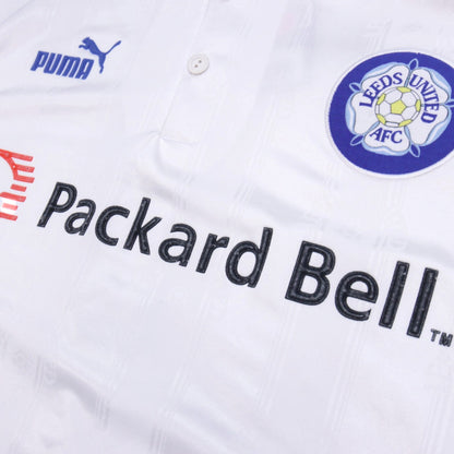 Close-up of Puma logo, Packard Bell sponsor and Leeds United crest