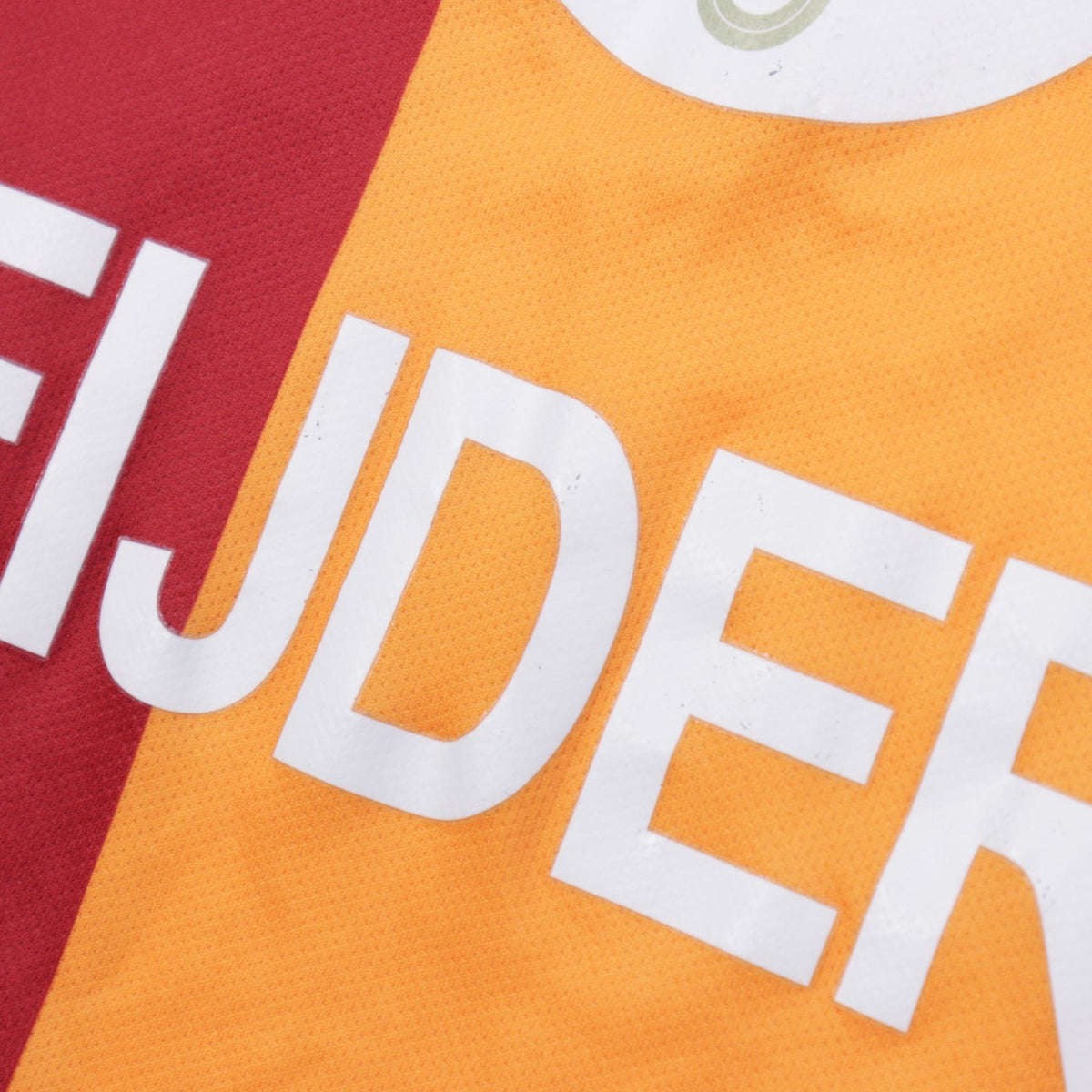 Close-up of the Sneijder name print on the Galatasaray shirt