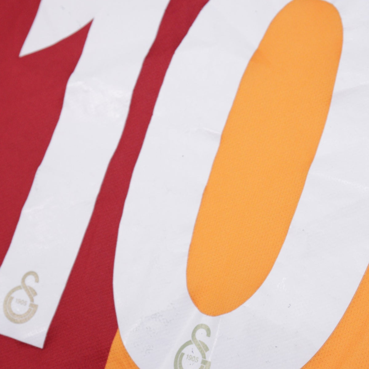 Close-up of the number 10 print showing fabric texture and light creasing