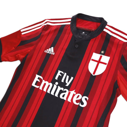 Close-up of the AC Milan crest, adidas logo and collar on the home shirt