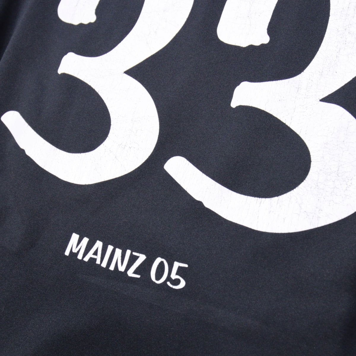 Close-up of number 33 and Mainz 05 text print on the back of the shirt