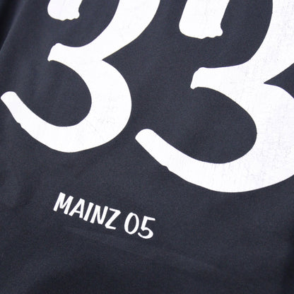 Close-up of number 33 and Mainz 05 text print on the back of the shirt